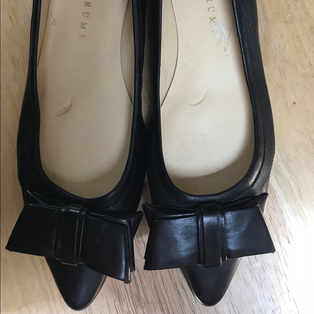 Black Ivanka Trump flats with bow.